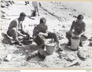 NAGADA, NEW GUINEA. 1944-08-16. VX84713 SERGEANT H. CARLSON (1); VX72103 GUNNER D.N. BENTLEY (2) AND VX131574 GUNNER F.A. MUDGE (3) OF THE 22ND BATTERY, 106TH TANK ATTACK REGIMENT DOING THEIR ..