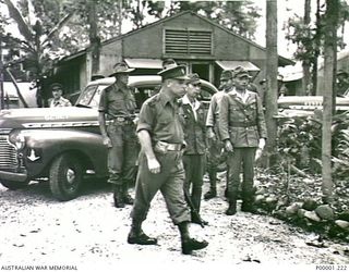 THE SOLOMON ISLANDS, 1945-09-08. BRIGADIER J. FIELD, COMMANDER AUSTRALIAN 7TH BRIGADE, WITH AUSTRALIAN AND JAPANESE SERVICE PERSONNEL, ARRIVING AT THE SURRENDER CEREMONY LOCATION AT TOROKINA, ..
