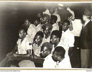 NEWCASTLE, NSW. 1944-01-28. AUSTRALIAN AND NEW GUINEA ADMINISTRATION UNIT NATIVES WATCHING A STEEL PIPE MILL IN OPERATION AT THE BROKEN HILL PTY. MILL