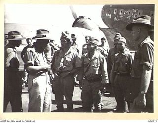 WEWAK AIRSTRIP, NEW GUINEA, 1945-09-20. AN ADVANCE PARTY FROM 18 JAPANESE ARMY ARRIVING BY PLANE AT HQ 6 DIVISION, FROM HAYFIELD. THEY ARE ON THEIR WAY TO ESTABLISH A CAMP FOR THE RECEPTION OF THE ..