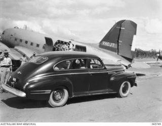 MAREEBA, QLD. 1944-04-13. THE STAFF CAR OF VX17 MAJOR-GENERAL J.E.S. STEVENS, DSO., ED., GENERAL OFFICER COMMANDING, 6TH DIVISION LEAVING THE AERODROME WITH MAJOR-GENERAL F.H. BERRYMAN, CBE., DSO., ..