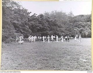 PORT MORESBY - DENSE TROPICAL BUSH RIGHT TO THE EDGE OF THE SPORTS OVAL. (NEGATIVE BY N. TRACY)