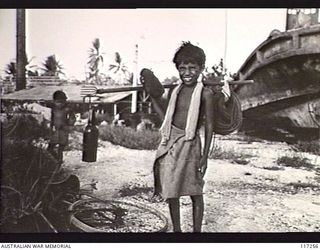 NAURU ISLAND. 1945-09-13. A LOCAL NAURUAN LAD POSES FOR HIS PHOTOGRAPH
