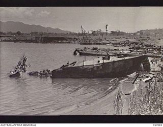 LAE, NEW GUINEA. 1943-09-19. WRECKAGE OF JAPANESE TRANSPORTS AT VOCO POINT. THIS PHOTOGRAPH ILLUSTRATES THE HAVOC CAUSED BY THE CONTINUED HEAVY ALLIED BOMBING OF THE AREA, PRIOR TO THE INVASION