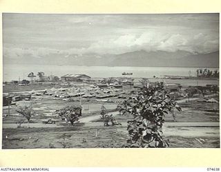 LAE. NEW GUINEA. 1944-07. ONE OF A NUMBER OF PHOTOGRAPHS TAKEN TO GIVE A 120 PANORAMIC VIEW OF THE TOWN OF LAE. TO JOIN TO PHOTOGRAPHS NO. 74635, 74636, 74637, 74639 AND 74640