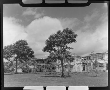 Looking across a grassy area to a two-stories building beyond, Lautoka, Fiji