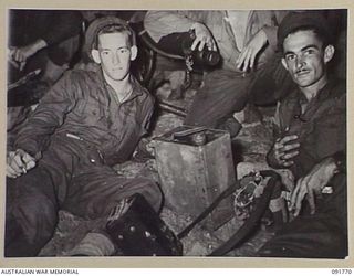 BOUGAINVILLE, 1945-05. A VICKERS MACHINE GUN CREW ON 1 BEACH AFTER THE NIGHT LANDING BY 26 INFANTRY BATTALION (A.I.F.) ON TOROKORI ISLAND IN MATCHIN BAY. IDENTIFIED PERSONNEL ARE:- PTE D. HOPE (1); ..