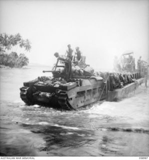 FINSCHHAFEN AREA, NEW GUINEA. 1943-10-27. TROOPS OF THE 9TH AUSTRALIAN DIVISION UNLOADING A MATILDA TANK FROM A LANDING CRAFT MECHANISED (LCM) AT KEDAM BEACH