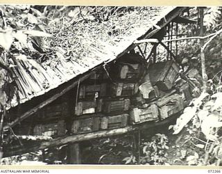 YAULA, NEW GUINEA. 1944-04-08. A JAPANESE AMMUNITION DUMP IN A GULLY NEAR AIYOU ABANDONED BY THE ENEMY WHEN THEY OCCUPIED A POSITION CLOSE TO BRIDGE 6, NEAR BOGADJIM