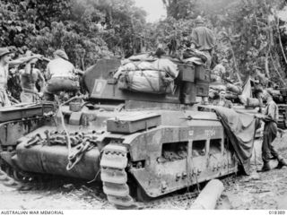 BOUGAINVILLE: 30 MARCH 1945. PRIOR TO CROSSING THE PURIATA RIVER THE AUSTRALIAN MANNED MATILDA TANKS OF B SQUADRON, 2/4 ARMOURED REGIMENT WERE MADE WATERPROOF BY THE USE OF THICK GREASE. TANK 72754 ..