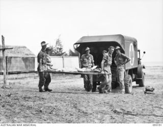 BOUGAINVILLE, 1945-06-18. PATIENTS FROM FORWARD AREAS BEING ADMITTED TO 109 CASUALTY CLEARING STATION, MOTUPENA POINT