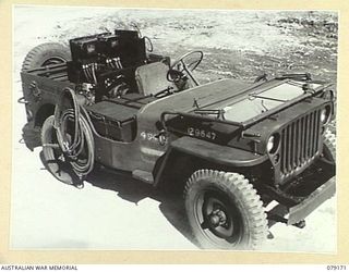 TOROKINA, BOUGAINVILLE ISLAND. 1945-02-22. A SLAVE CHARGER FITTED INTO A JEEP OF B SQUADRON WORKSHOP, 2/4TH ARMOURED REGIMENT. THE DESIGN AND FITTING OF THESE UNITS WAS DONE BY THE UNIT WORKSHOP ..