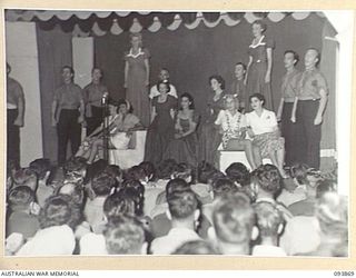 LAE AREA, NEW GUINEA, 1945-07-09. THE FULL CAST OF THE ACT "A PRETTY GIRL" IN THE REVUE "OVER TO YOU", STAGED BY 19 LINES OF COMMUNICATION AREA SIGNALS IN THE UNIT'S RECREATION HUT, WHICH WAS KNOWN ..