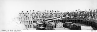 Port Moresby, Papua. 1942-07-15. Personnel of 23rd Australian Heavy Anti-Aircraft Battery with one of their 3.7 inch guns in the foreground