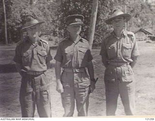 TOROKINA, SOUTH BOUGAINVILLE ISLAND, 1945-10-19. LEFT TO RIGHT: CAPTAIN J. OLIVER, BRIGADE MAJOR 29TH BRIGADE; BRIGADIER H. W. SIMPSON DSO, COMMANDING OFFICER 29TH BRIGADE, AND CAPTAIN J. O'SHEA, ..