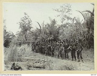 Personnel of the Fighting Patrol from C Company, 2/1 Infantry Battalion. Identified: unidentified Artillery Signaller, 2/2 Field Regiment (1); unidentified Artillery Signaller, 2/2 Field Regiment ..