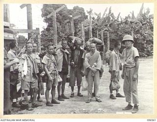 TOROKINA, BOUGAINVILLE. 1945-09-14. SOME OF THE MEMBERS OF A PARTY OF 79 CHINESE AT TOROKINA COMPOUND. FORMER PRISONERS OF THE JAPANESE THEY WERE RELEASED WHEN AUSTRALIAN TROOPS OCCUPIED THE ..