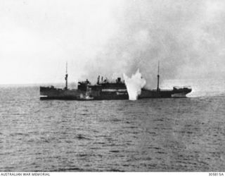 PACIFIC OCEAN. 1940-06-12. THE BURNING ITALIAN ROMOLO STRUCK AT THE WATERLINE BY 6 INCH GUNFIRE FROM THE ARMED MERCHANT CRUISER HMAS MANOORA. ROMOLO SCUTTLED HERSELF ON BEING OVERTAKEN IN THE ..