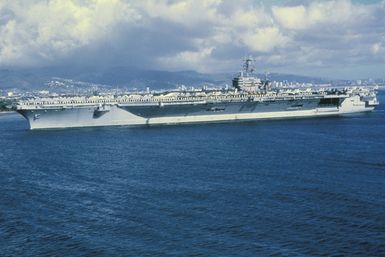 Aerial port view of the nuclear-powered guided missile cruiser USS CARL VINSON (CVN 70) entering port