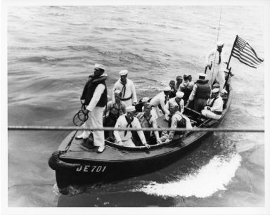 Whaleboat from USS Osmus carrying Japanese surrenders