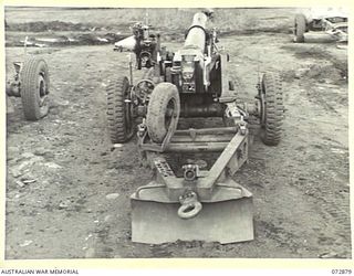 LAE, NEW GUINEA. 1944-05-03. A 25 POUNDER "SHORT" (AUSTRALIAN) MARK I GUN WHICH WAS PARACHUTED INTO THE RAMU VALLEY AND USED BY ARTILLERYMEN OF THE 2/4TH FIELD REGIMENT. THE GUN, IS THE FIRST ..