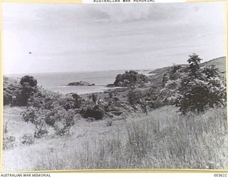 PORT MORESBY GAOL (ON ISLAND IN CENTRE OF PICTURE), CAUSEWAY TO MAINLAND. RAAF SURVEY FLIGHT. (NEGATIVE BY N. TRACY)