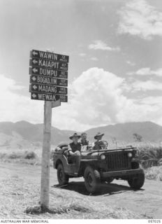 NADZAB AIRSTRIP, NEW GUINEA. 1943-09-19. SIGNPOST ON THE ROAD BETWEEN NO. 1 AND NO. 2 AIRSTRIPS