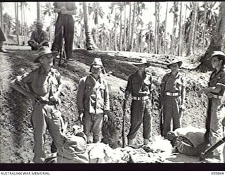 KOKOPO, NEW BRITAIN, 1946-02-28. MEMBERS OF 3 GROUP CAMP, 11 DIVISION, SEARCHING JAPANESE TROOPS BEFORE THEY LEAVE THE CAMP TO BOARD THE DEMILITARIZED AIRCRAFT CARRIER KATSURAGI FOR THEIR JOURNEY ..