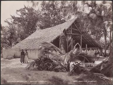 Villagers standing beside the church at Rowa, Banks Islands, 1906 / J.W. Beattie