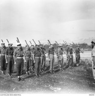 CAPE WOM, NEW GUINEA, 1945-09-13. A DETACHMENT OF RAN PERSONNEL TAKING UP THEIR POSITIONS ON PARADE FOR THE SURRENDER CEREMONY HELD AT CAPE WOM AIRSTRIP WHERE LIEUTENANT-GENERAL H. ADACHI, ..