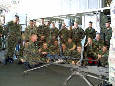 US Marines, Special Operations Capable, 24th Marine Expeditionary Unit (MEU) embarked aboard the amphibious assault ship USS GUAM (LPH 9) receive weapons training, on the M2 HB (Heavy Barrel).50 caliber heavy machine gun, while the ship moves closer to the Persian Gulf. The GUAM deployed to the gulf as part of an increased military presence in response to a US Central Command (US CENTCOM) request for additional forces, 10 February 1998