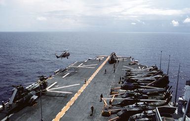 A British HAS, Mark 2 Lynx helicopter comes in to land aboard the amphibious assault ship USS SAIPAN (LHA 2) during Operation Sharp Edge. Marines embarked aboard the SAIPAN have been sent to the U.S. Embassy in Monrovia, Liberia, to augment security and evacuate U.S. and foreign nationals from the fighting between government and rebel forces