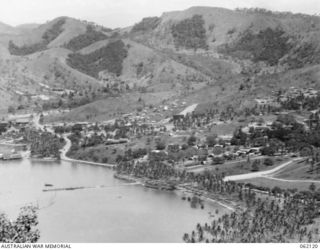 PORT MORESBY AREA, NEW GUINEA. 1943-12-29. VIEW TAKEN FROM TUA-GUBA HILL LOOKING TOWARDS GENERAL HEADQUARTERS AND THE UNITED STATES NAVY HEADQUARTERS NEAR HANUABADA
