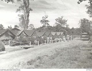 LAE BASE AREA, NEW GUINEA. 1944-12-01. THE WELL KEPT CAMP AREA OF NO. 4 PLATOON, 22ND WORKS COMPANY