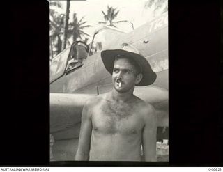 MOMOTE, LOS NEGROS ISLAND, ADMIRALTY ISLANDS. 1944-03-18. A BARE-CHESTED LEADING AIRCRAFTMAN R. BRITNELL OF GYMPIE, QLD, ARMOURER, WHO IS TYPICAL OF THE GROUND STAFF OF NO. 76 (KITTYHAWK) SQUADRON ..