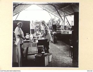 MOROTAI ISLAND. 1945-05-16. SCENE IN THE WORKROOM AND STERILISING ROOM ATTACHED TO THE OPERATING THEATRE, 2/5 GENERAL HOSPITAL. WITH TWO OPERATIONS IN PROGRESS THE ROOM PRESENTS A BUSY SCENE. ..