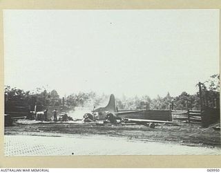 NEW GUINEA, MILNE BAY. 1943-03. REMAINS OF A UNITED STATES B17 FLYING FORTRESS DESTROYED BY JAPANESE BOMBERS IN ITS DISPERSAL BAY AT TURNBULL FIELD