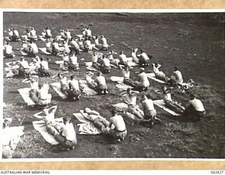 THORPVILLE, NEW GUINEA. 1943-12-07. POSTURE CASE PATIENTS DOING CORRECTIVE EXERCISES AT THE 113TH AUSTRALIAN CONVALESCENT DEPOT