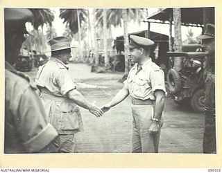 AITAPE, NEW GUINEA. 1945-03-20. GENERAL SIR THOMAS A. BLAMEY, COMMANDER-IN-CHIEF, ALLIED LAND FORCES, SOUTH WEST PACIFIC AREA (1), SHAKING HANDS WITH LIEUTENANT-COLONEL W.H. MENCE, CORPS OF ..