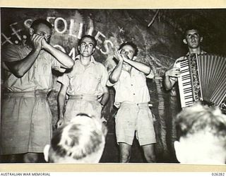 PAPUA. 1942-08-19. SOME OF THE PERFORMERS AT A COMMUNITY SINGING CONCERT HELD AT PORT MORESBY BY NO.4 FIGHTER SECTION RAAF