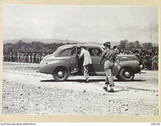 CAPE WOM, NEW GUINEA, 1945-09-13. MAJOR GENERAL H.C.H. ROBERTSON, GENERAL OFFICER COMMANDING 6 DIVISION, ENTERING HIS CAR AT THE CONCLUSION OF THE SURRENDER CEREMONY HELD AT CAPE WOM AIRSTRIP. ..