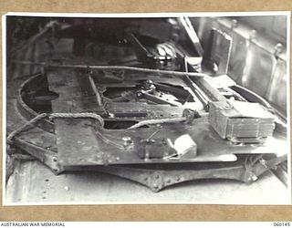 WARD'S DROME, NEW GUINEA. 1943-11-16. THE DISMANTLED PARTS OF A LONG 25-POUNDER GUN LASHED DOWN IN DOUGLAS TRANSPORT AIRCRAFT, DURING AN EXPERIMENTAL AIR SUPPLY OPERATION, BY THE 2/5TH AUSTRALIAN ..