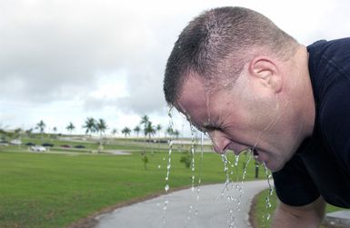 US Air Force (USAF) First Lieutenant (1LT) Keith Quick, 36th Security Forces Squadron (SFS), takes a much-needed break after completing a 1.5-mile run. Team Andersen challenge is a quarterly moral and readiness building event where participants compete in an obstacle course, knowledge bowl, and a 1.5-mile run