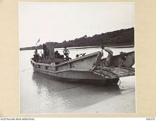 MUSCHU ISLAND, NEW GUINEA, 1945-09-09. A SURRENDERED JAPANESE BARGE MANNED BY AN AUSTRALIAN CREW