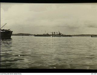 Los Negros Island, Admiralty Group. c. 1944. Royal Australian Navy cruiser HMAS Australia anchored off the island