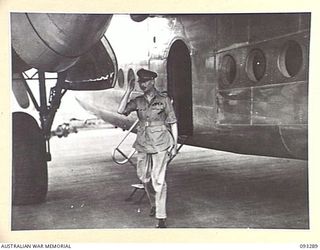 NADZAB AREA, NEW GUINEA, 1945-06-26. HIS ROYAL HIGHNESS, THE DUKE OF GLOUCESTER, GOVERNOR GENERAL OF AUSTRALIA, TAKING THE SALUTE ON ARRIVAL AT NADZAB AIRSTRIP, HQ FIRST ARMY AREA, ON A TOUR OF ..