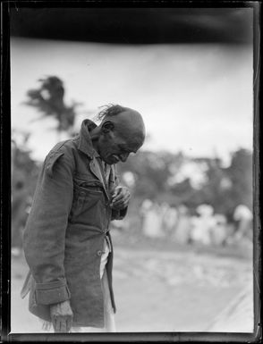 An unidentified Fijian man, wearing a military jacket, Suva, Fiji