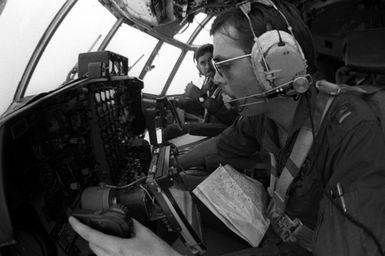 CPT Dikki Stanley of the 54th Weather Reconnaissance Squadron pilots a WC-130 Hercules aircraft through a typhoon in order to get first hand information on barometric pressure, wind strength, temperatures and directions. This information is relayed to meterorological specialists at the Joint Typhoon Warning Center