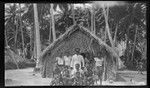 Mixed group in Potaminam Village, Ninigo Islands, in front of house