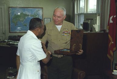 (LGEN) D'Wayne Gray, commanding general, Fleet Marine Force Pacific, receives a gift from Admiral Romly, chief of staff, Indonesian Navy